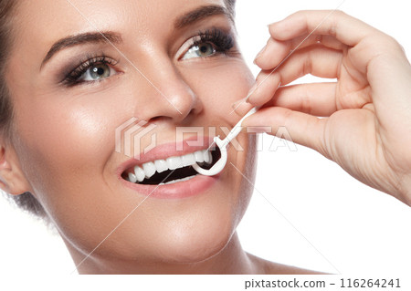 Woman with dental floss pick on white background Woman with dental floss pick on white background 116264241