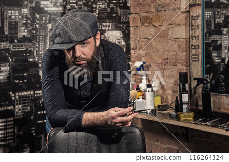 Portrait of stylish hairdresser man in his studio Portrait of stylish hairdresser man in his studio 116264324