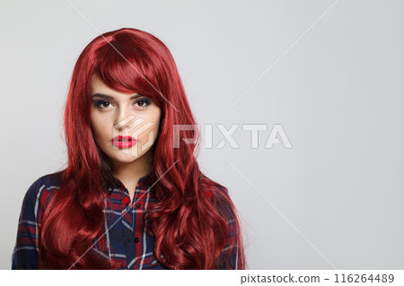 Casual redhead woman with Long Healthy and Shiny Curly Hair. Care and Beauty. Beautiful Model Woman Casual redhead woman with Long Healthy and Shiny Curly Hair. Care and Beauty. Beautiful Model Woman 116264489