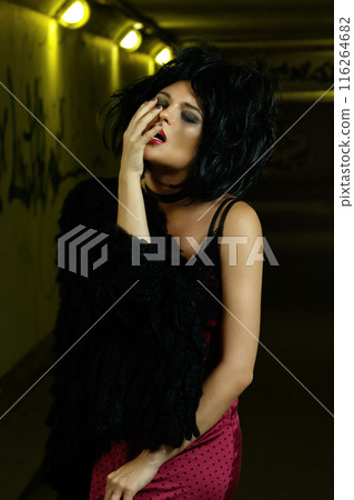 Strange and freaky woman in dark underground Strange and freaky woman in dark underground 116264682