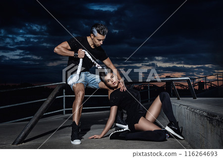 Stylish couple in the skate park at night 116264693