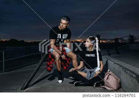 Stylish couple in the skate park at night 116264701