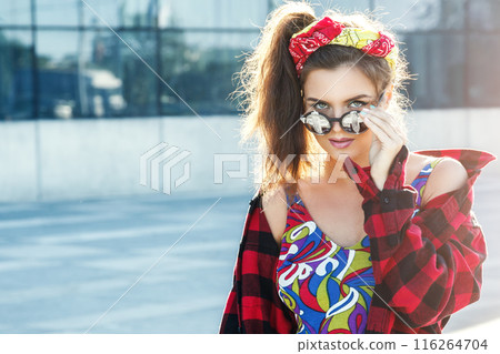 Beautiful and stylish girl on the street Beautiful and stylish girl on the street 116264704