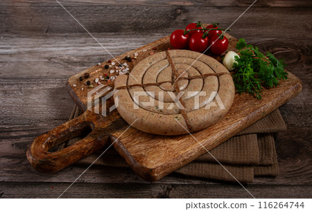 raw spiral sausages, on a wooden board, top view, no people, raw spiral sausages, on a wooden board, top view, no people, 116264744