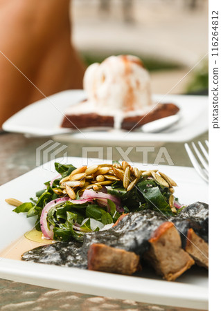 Beef meat and black sauce with beans 116264812