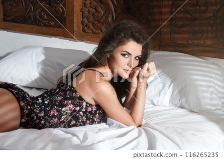 Sexy woman lying on the bed at the morning Sexy woman lying on the bed at the morning 116265235
