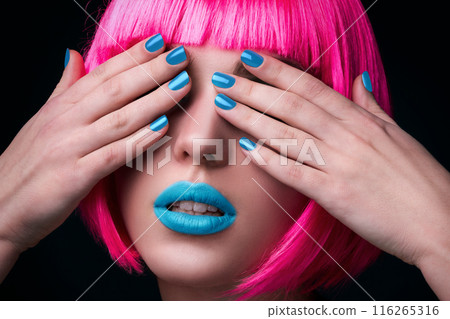 Potrait of young woman with pink hair 116265316