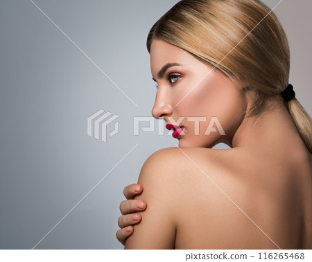 Portrait of beautiful blonde girl with red lips Portrait of beautiful blonde girl with red lips 116265468