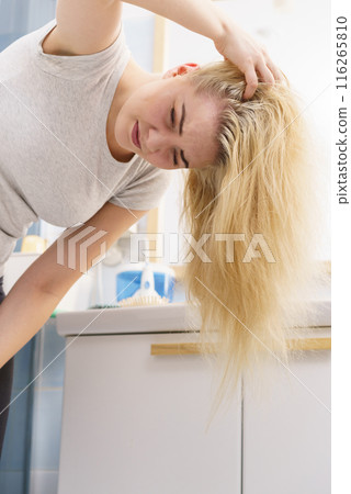 Female having problem with blonde hair Female having problem with blonde hair 116265810