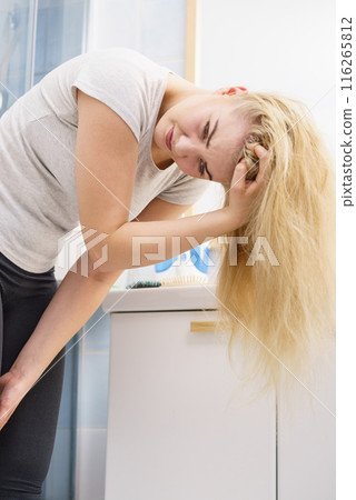 Female having problem with blonde hair Female having problem with blonde hair 116265812