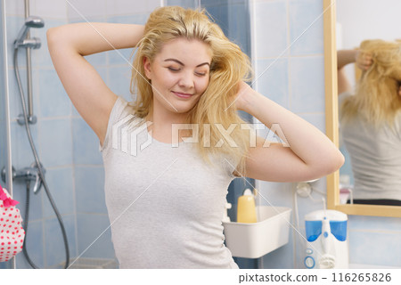 Happy fresh blonde woman in bathroom Happy fresh blonde woman in bathroom 116265826