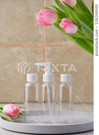 Transparent plastic container with a dispenser on the table. Bottle for liquid soap 116266088