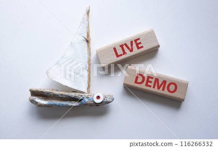 Live Demo symbol. Concept word Live Demo on wooden blocks. Beautiful white background with boat. Business and Live Demo concept. Copy space 116266332