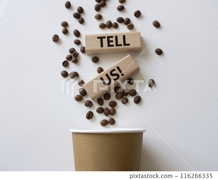 Tell us symbol. Concept words Tell us on wooden blocks. Beautiful white background with coffee cup. Business and Tell us concept. Copy space. 116266335