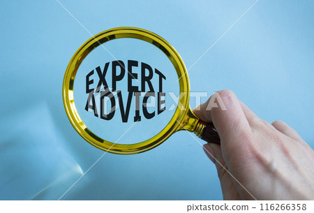 Expert advice symbol. Concept word Expert advice on magnifying glass. Businessman hand. Beautiful blue background. Business and Expert advice concept. Copy space 116266358