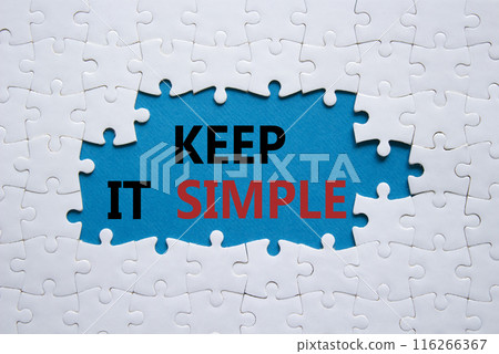 Keep it Simple symbol. Concept words Keep it Simple on white puzzle. Beautiful blue background. Business and Keep it Simple concept. Copy space. 116266367