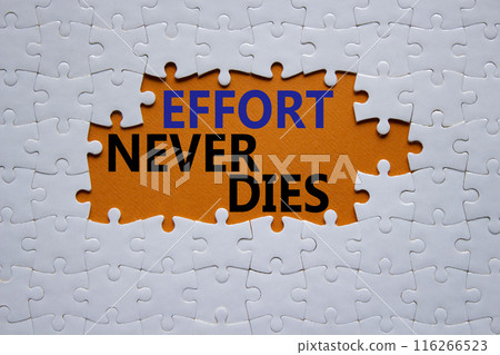 Effort never dies symbol. Concept words Effort never dies on white puzzle. Beautiful orange background. Business and Effort never dies concept. Copy space. 116266523