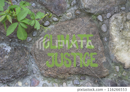 Climate Justice symbol. Stone wall with words Climate Justice . Beautiful stone background. Business and Climate Justice concept. Copy space. Climate Justice symbol. Stone wall with words Climate Justice . Beautiful stone background. Business and Climate Justice concept. Copy space. 116266553