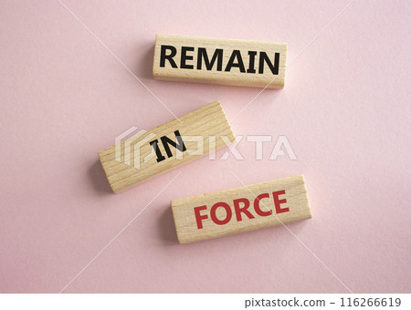 Remain in Force symbol. Concept words Remain in Force on wooden blocks. Beautiful pink background. Business and Remain in Force concept. Copy space Remain in Force symbol. Concept words Remain in Force on wooden blocks. Beautiful pink background. Business and Remain in Force concept. Copy space 116266619
