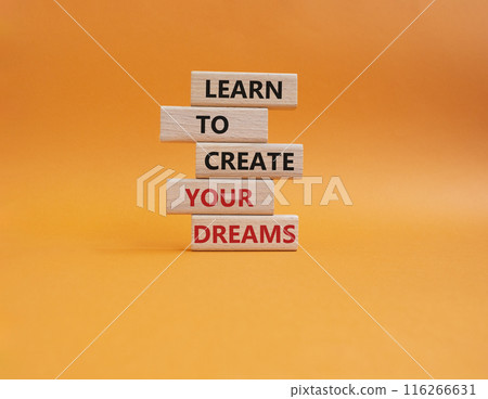Dreams symbol. Concept words Learn to create your Dreams on wooden blocks. Beautiful orange background. Business and Learn to create your Dreams concept. Copy space. 116266631