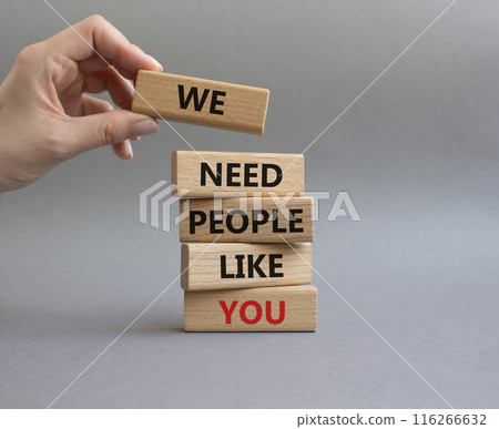 Hiring symbol. Wooden blocks with words We need People like You. Businessman hand. Beautiful grey background. Business and Hiring concept. Copy space. 116266632