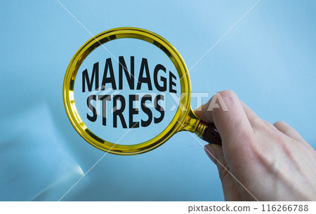 Manage stress symbol. Concept word Manage stress on magnifying glass. Businessman hand. Beautiful blue background. Business and Manage stress concept. Copy space Manage stress symbol. Concept word Manage stress on magnifying glass. Businessman hand. Beautiful blue background. Business and Manage stress concept. Copy space 116266788