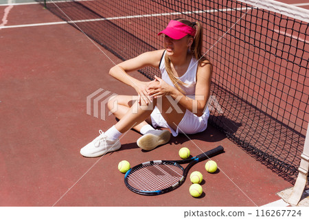 a young tennis player was injured while playing tennis, big tennis concept, sports injuries a young tennis player was injured while playing tennis, big tennis concept, sports injuries 116267724