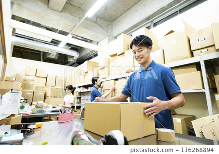 A man working in a warehouse A man working in a warehouse 116268894
