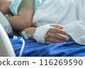 Asian todler in hospital with intravenous saline. Sick children, infected with the virus, are lying and being treated in beds in hospitals. 116269590