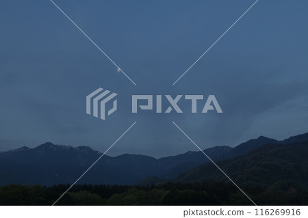 The moon hanging over the Southern Alps 116269916