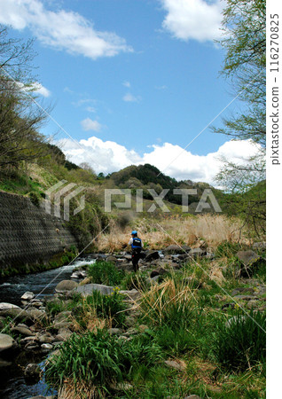 An angler fishing in the Daimon River, which flows through the foothills of the Yatsugatake Mountains and into the Sutamagawa River An angler fishing in the Daimon River, which flows through the foothills of the Yatsugatake Mountains and into the Sutamagawa River 116270825