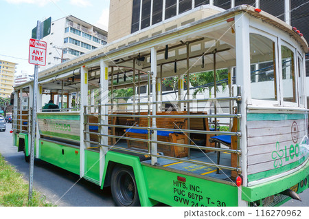 Trolleys running through Honolulu 116270962