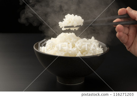 Picking up rice with chopsticks Steam 116271203