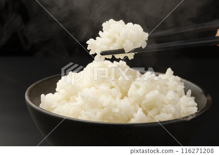 Picking up rice with chopsticks Steam 116271208