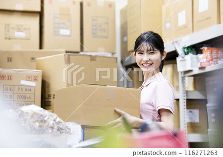A woman working in a warehouse A woman working in a warehouse 116271263