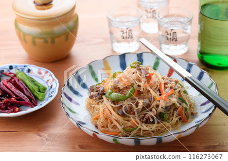 Japchae (mixed vegetables), a traditional Korean dish of stir-fried glass noodles 116273067