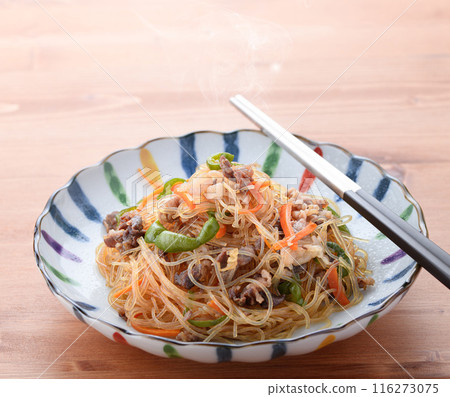 Japchae (mixed vegetables), a traditional Korean dish of stir-fried glass noodles Japchae (mixed vegetables), a traditional Korean dish of stir-fried glass noodles 116273075