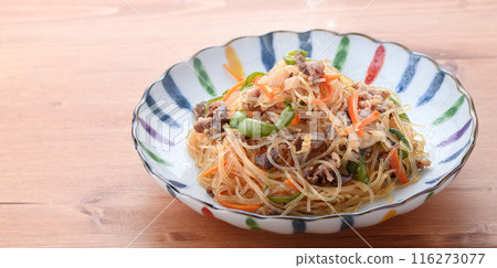 Japchae (mixed vegetables), a traditional Korean dish of stir-fried glass noodles 116273077