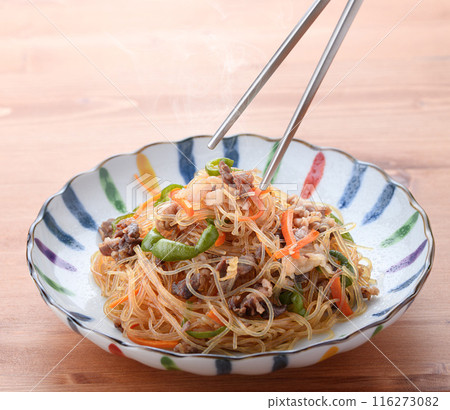 Japchae (mixed vegetables), a traditional Korean dish of stir-fried glass noodles 116273082
