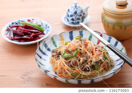 Japchae (mixed vegetables), a traditional Korean dish of stir-fried glass noodles 116273083