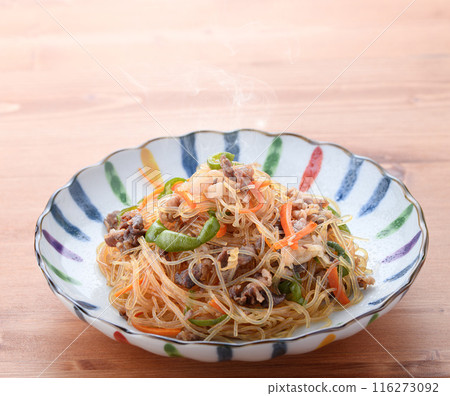Japchae (mixed vegetables), a traditional Korean dish of stir-fried glass noodles 116273092