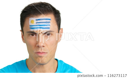 Serious man with a uruguayan flag painted on the face 116273117