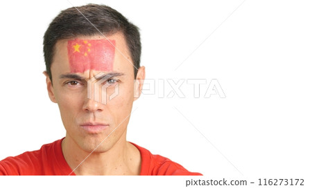 Serious man with a chinese flag painted on the face Serious man with a chinese flag painted on the face 116273172