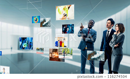 Multinational group looking at holographic images 116274504