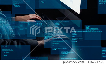 Programming image with a woman using a computer in a dark room Programming image with a woman using a computer in a dark room 116274736