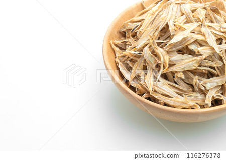 dried small crispy fish on white background dried small crispy fish on white background 116276378