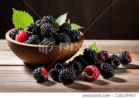 Fresh blackberries on wooden table, blackberries with sunlight, sweet berry on wood background. 116276407