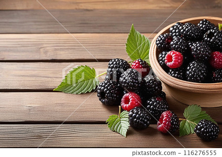 Fresh blackberries on wooden table, blackberries with sunlight, sweet berry on wood background. 116276555