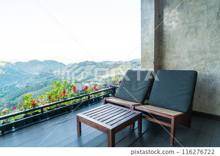 chair on balcony with mountain hill background 116276722