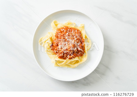 pork bolognese fettuccine pasta with parmesan cheese 116276729